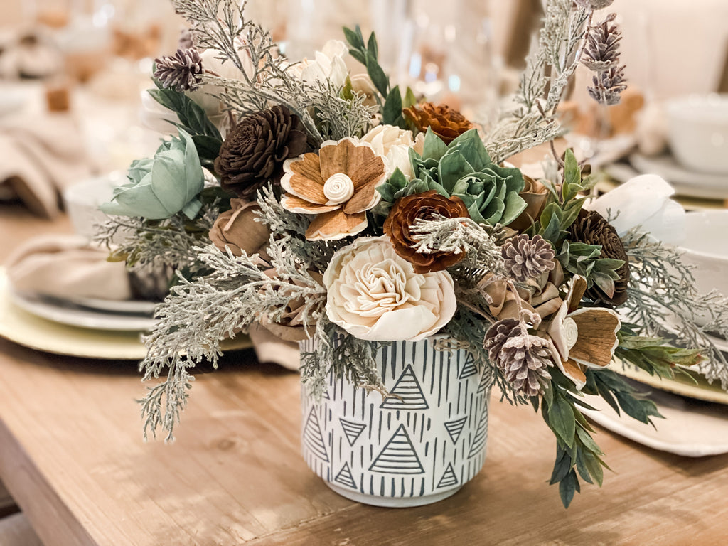 pine and pinecone with frosted greenery christmas sola flower arrangement