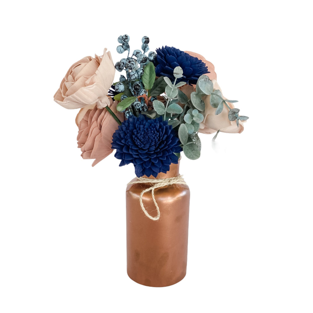 blueberry, navy and pink sola wood flower arrangement in rose gold vase