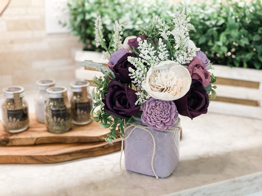 purple sola flower and succulent arrangement for home decor