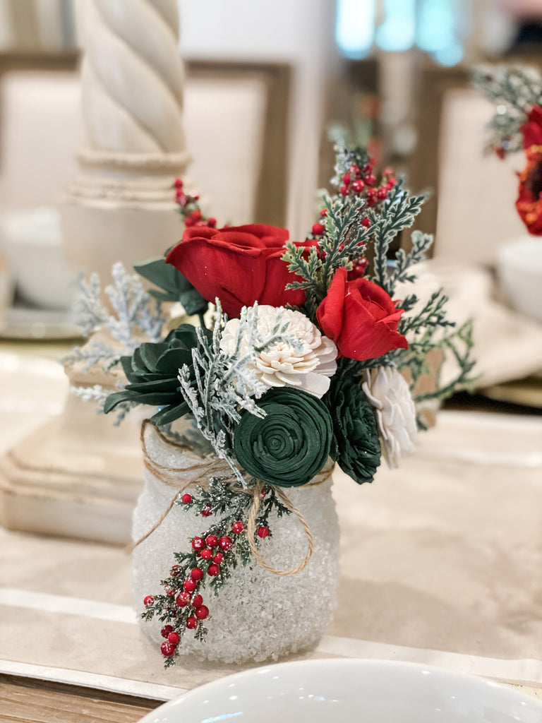 red and green christmas arrangement for table