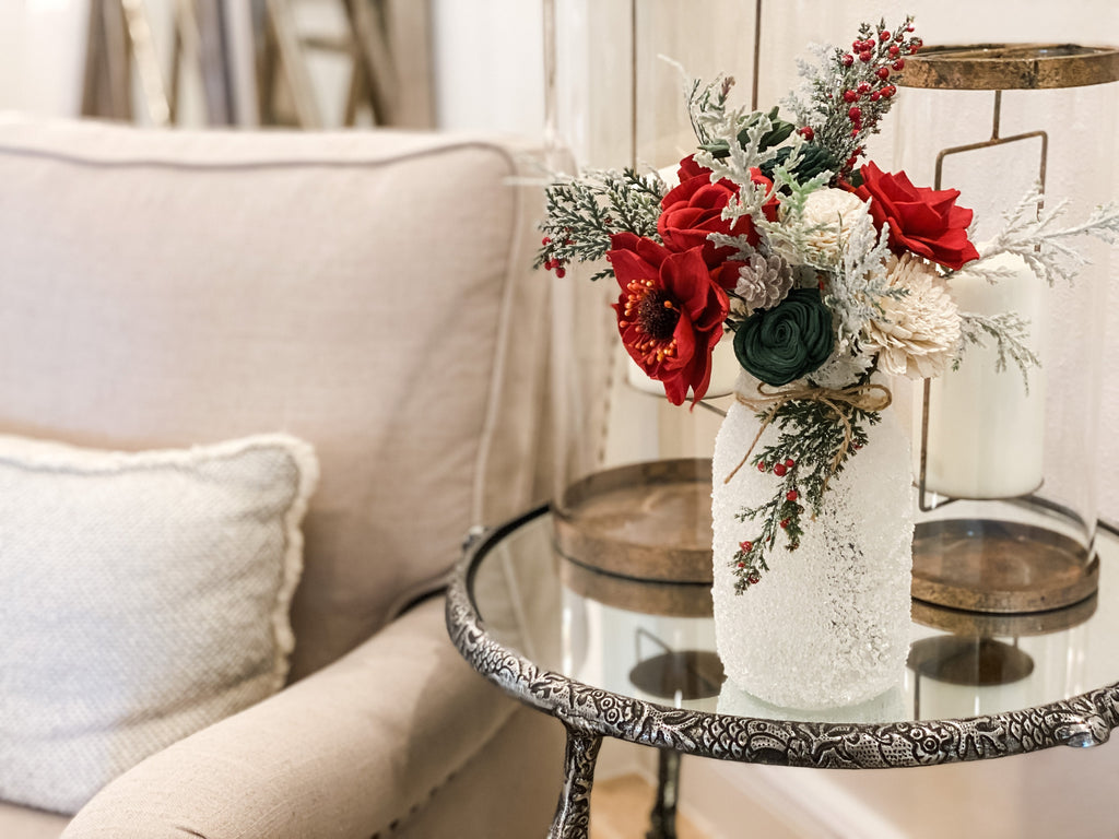 the best winter farmhouse decor 2020 includes sola wood flowers and a snow frosted mason jar