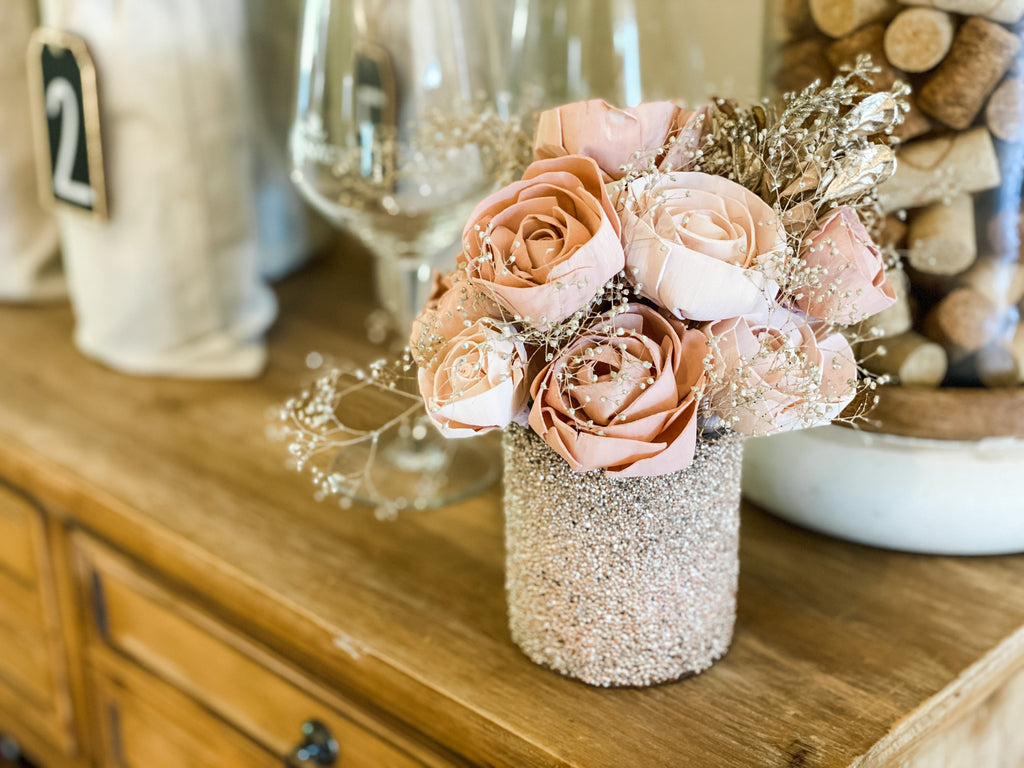 send her a sola wood flower arrangement to her door in pink roses and champagne accents