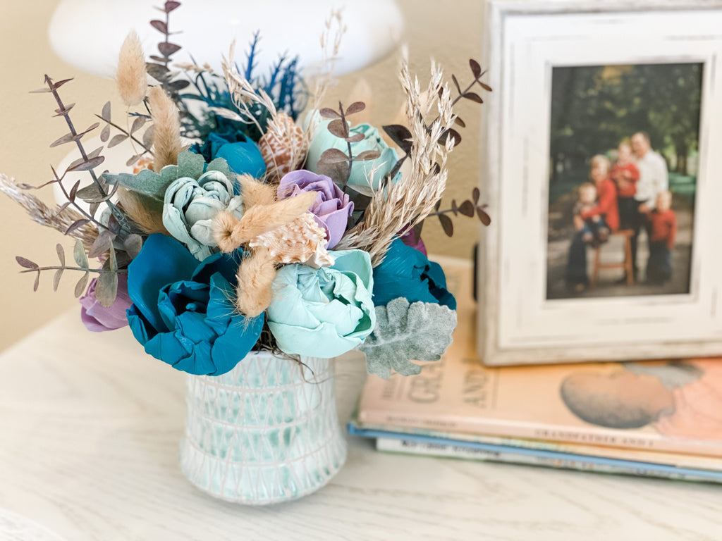 beautiful sola wood flower arrangement in purple and teal by pine and petal market