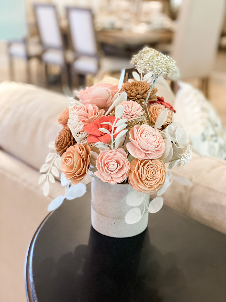boho flower arrangement with peach and pink by pine and petal market