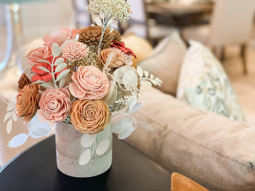 boho sola wood flower arrangement in peaches and pink with pearlized foliage