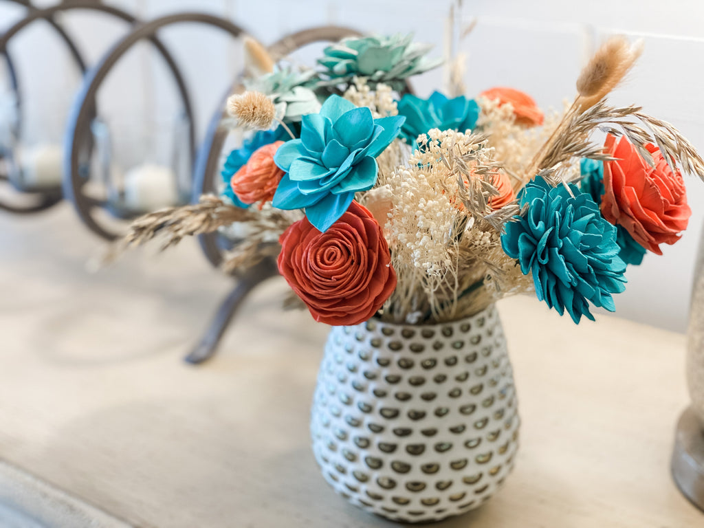 send a beach arrangement in coral and teal by pine and petal for housewarming or birthday gift