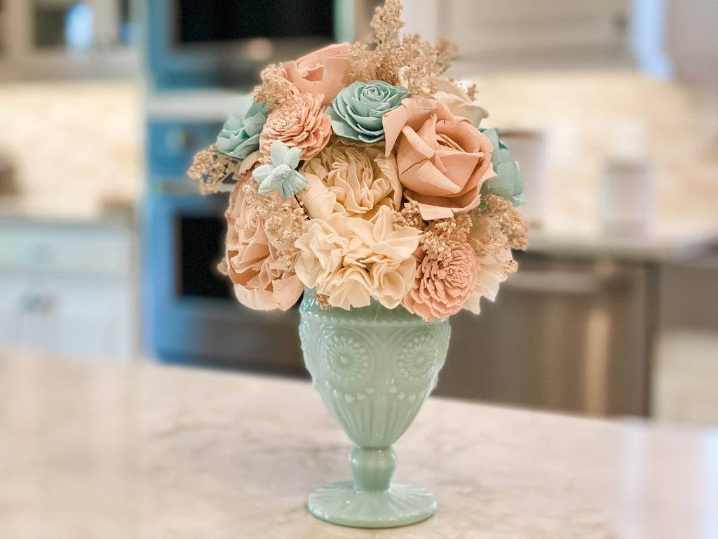 beautiful sola wood flower arrangement for sympathy or cheer in mint and pink