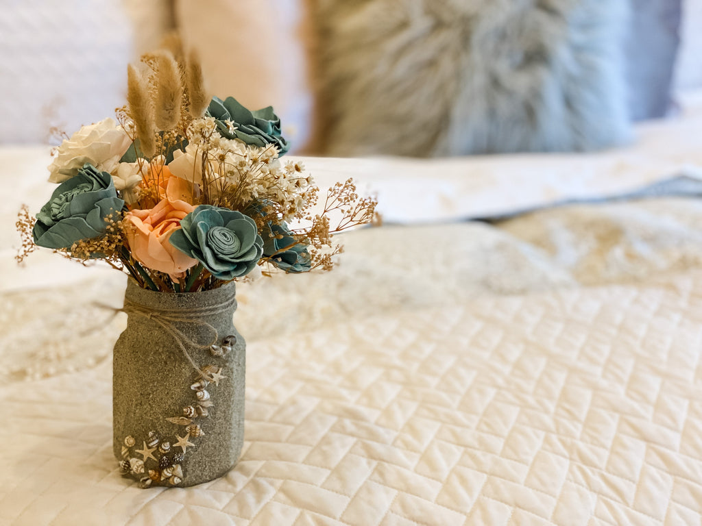 faux flower arrangement with sand and shell ball mason jar for beach house decor