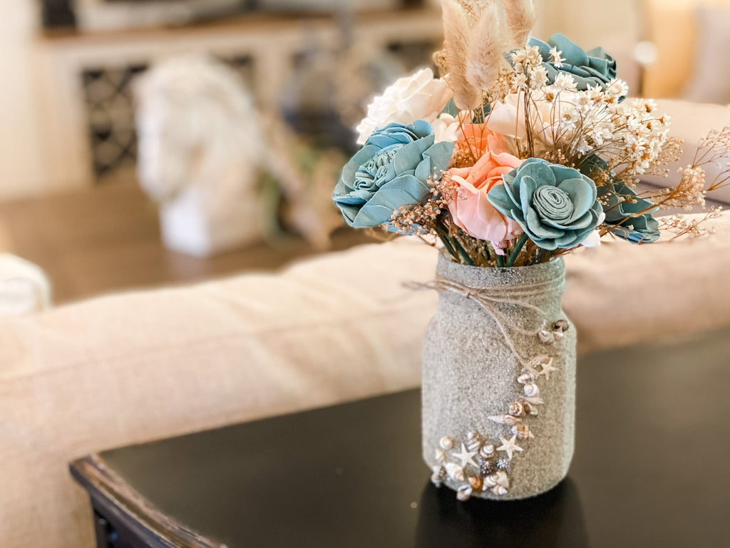 birthday gift ideas for beach lover of a faux flower bouquet made of sola wood flowers in corals and teal
