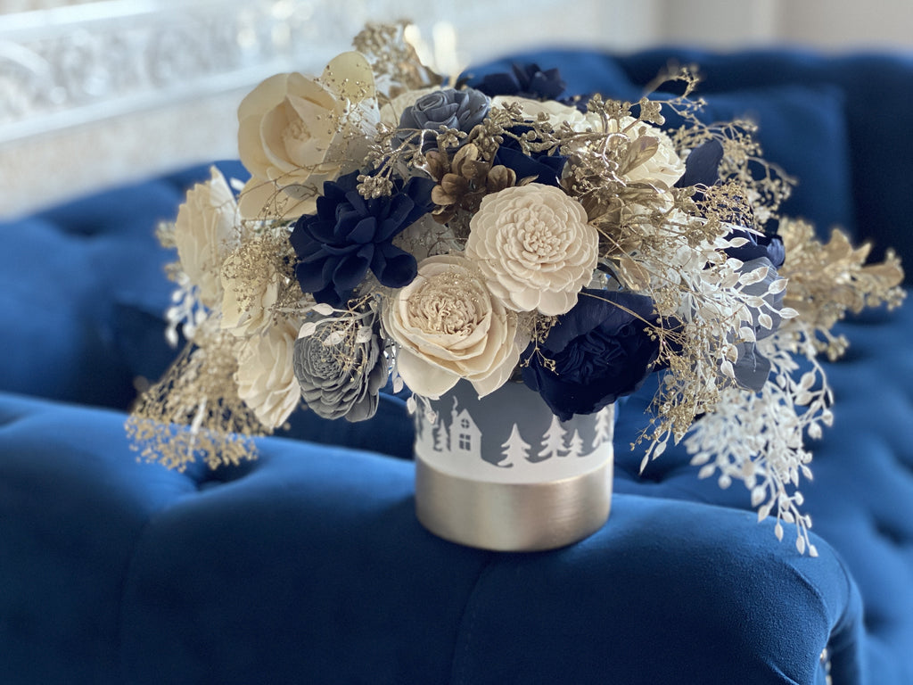 blue and white sola wood flower winter arrangement from pine and petal market