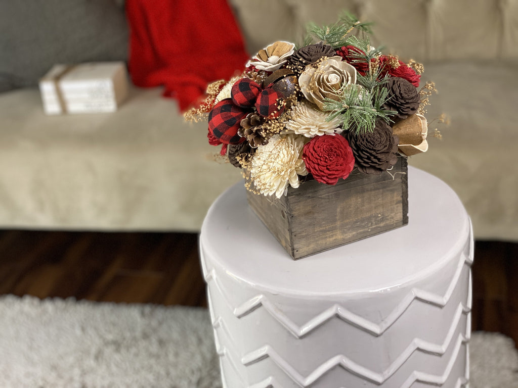 cozy sola wood flower decor and arrangement for christmas with buffalo plaid