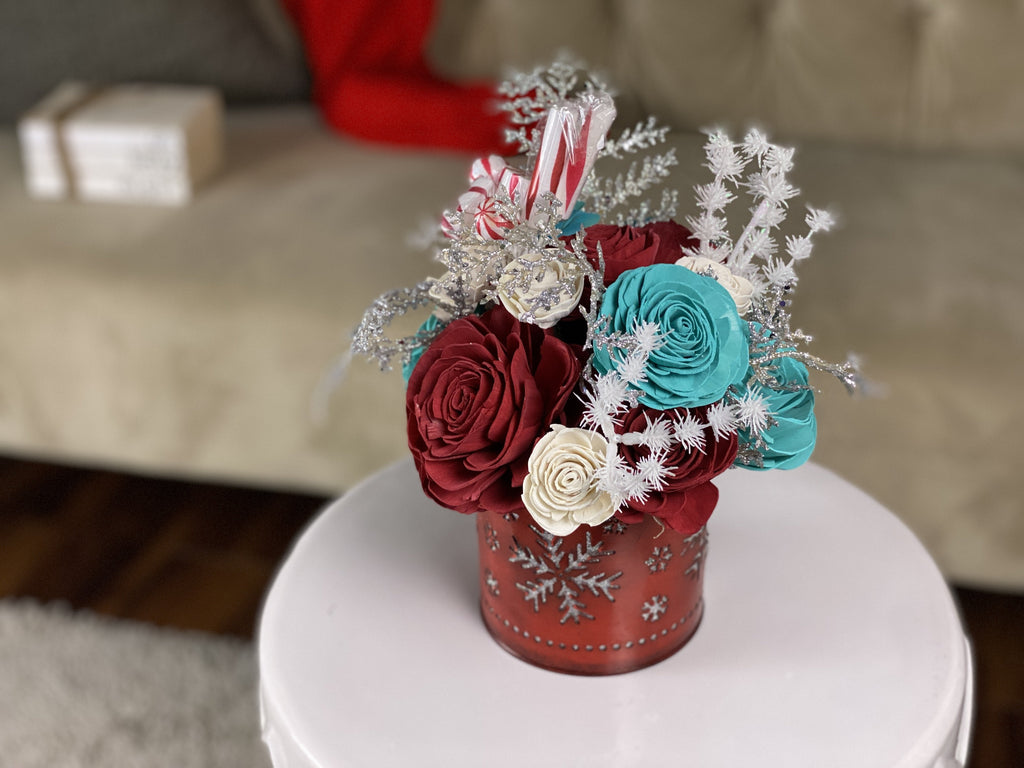 sola wood flower arrangement with peppermint candies in red and teal