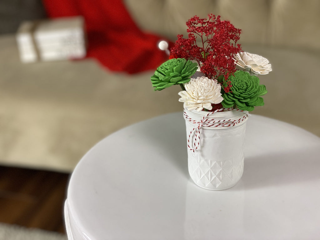 green and red christmas mini sola wood flower arrangement from pine and petal market