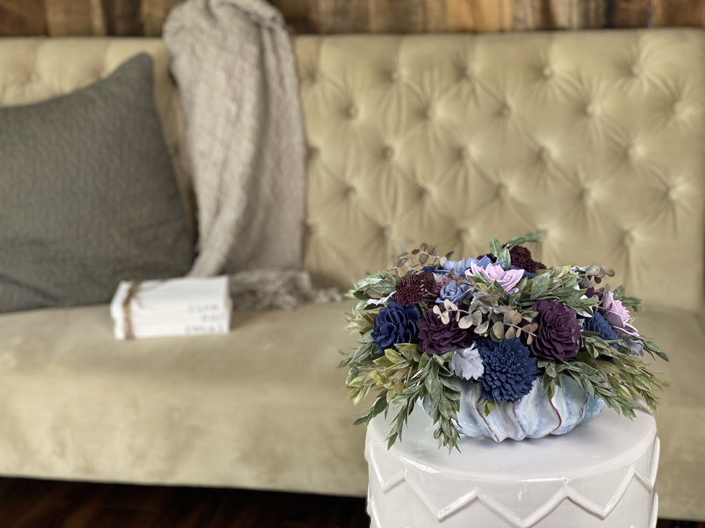 beautiful sola wood flower arrangement in purple and blue with sola succulents