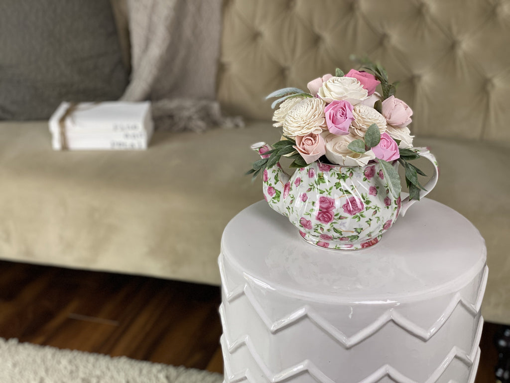 pink teapot sola wood flower arrangement by pine and petal market