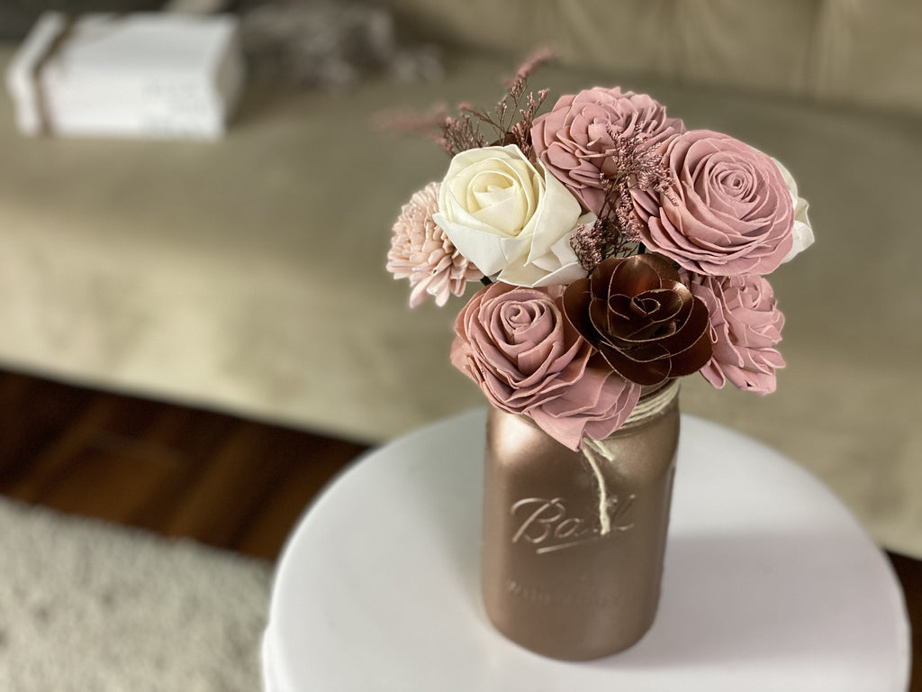 pink and blush sola wood flower arrangement in rose gold mason jar