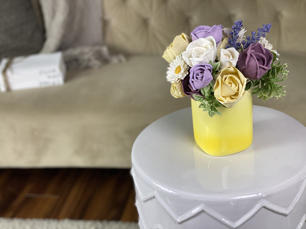 sola wood flower arrangement for spring wedding in yellow and purple
