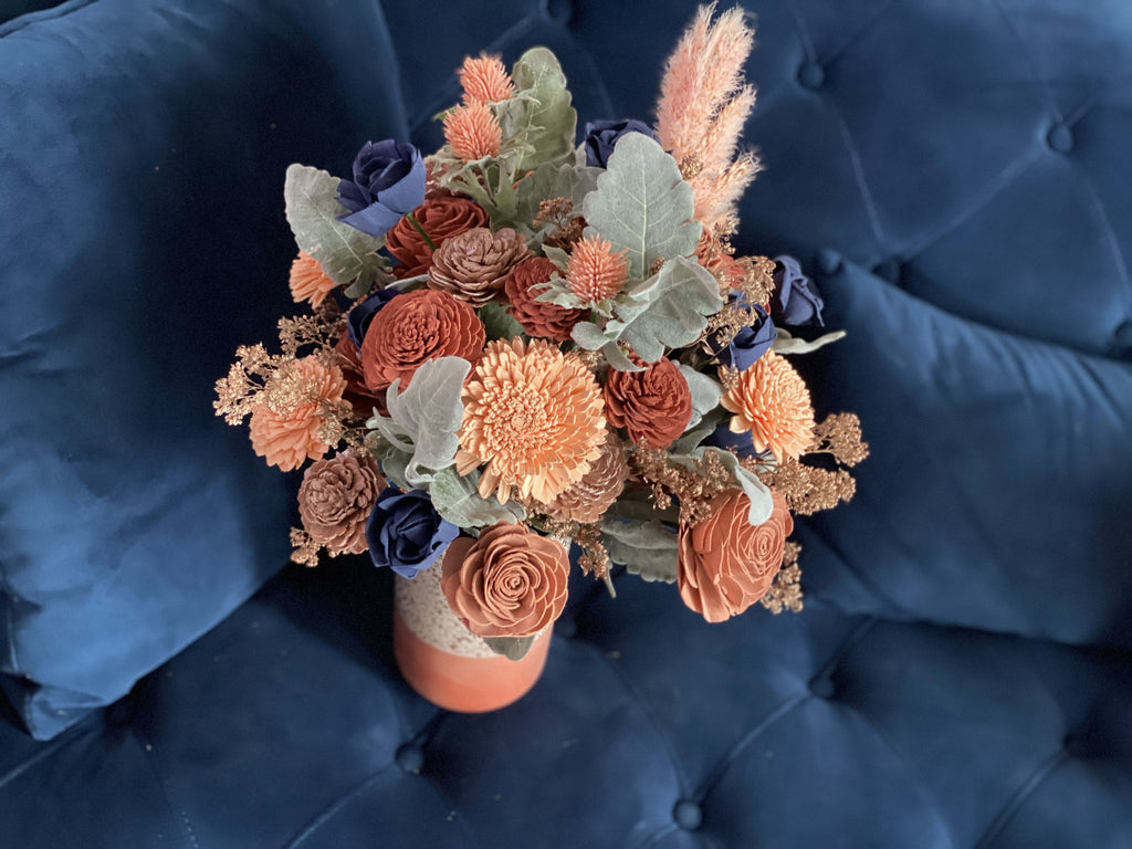 navy accented sola wood flower arrangement with rose gold and thistles. Boho decor and bouquet ideas