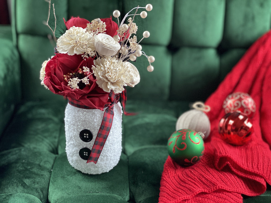 snowman pint mason jar arrangement with sola flowers for holidays