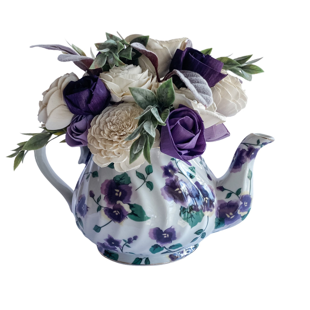 purple flower teapot sola wood flower arrangement by pine and petal market