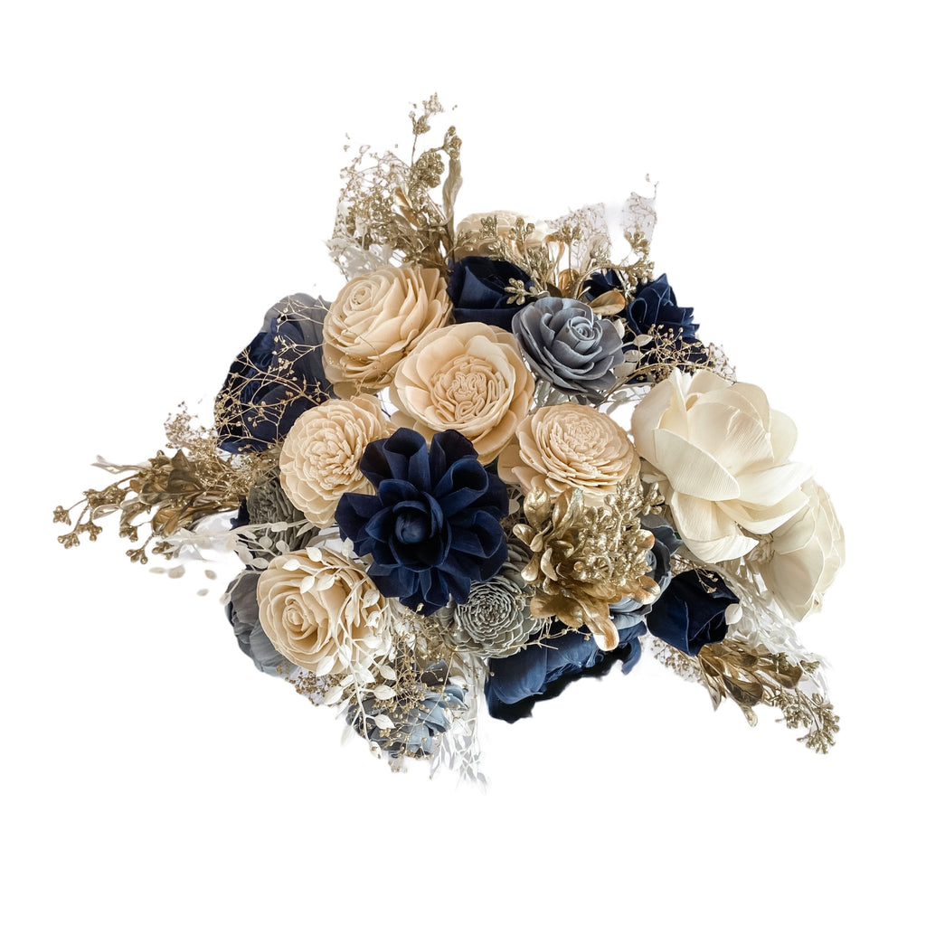 winter wedding flower bouquet ideas in blues and white with champagne gold accents