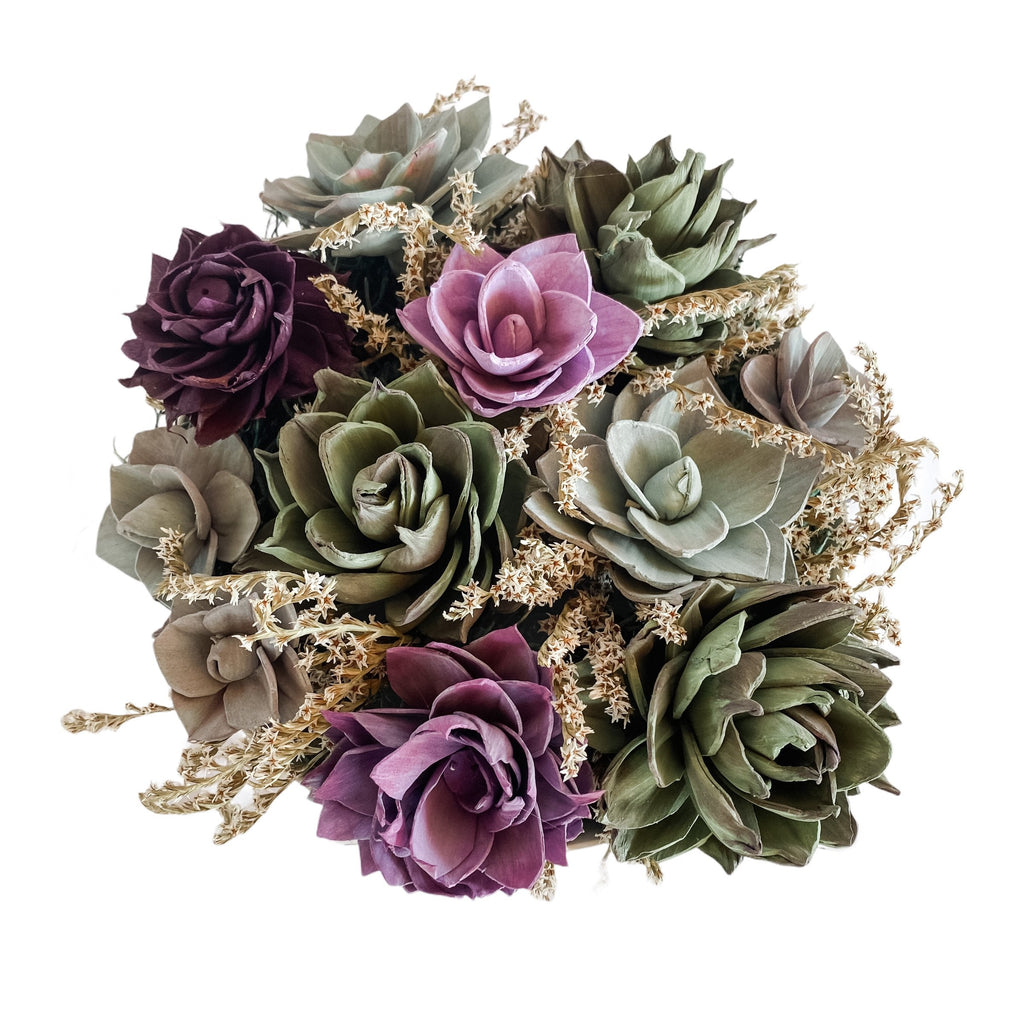 purple and green succulent sola wood flower arrangement by pine and petal