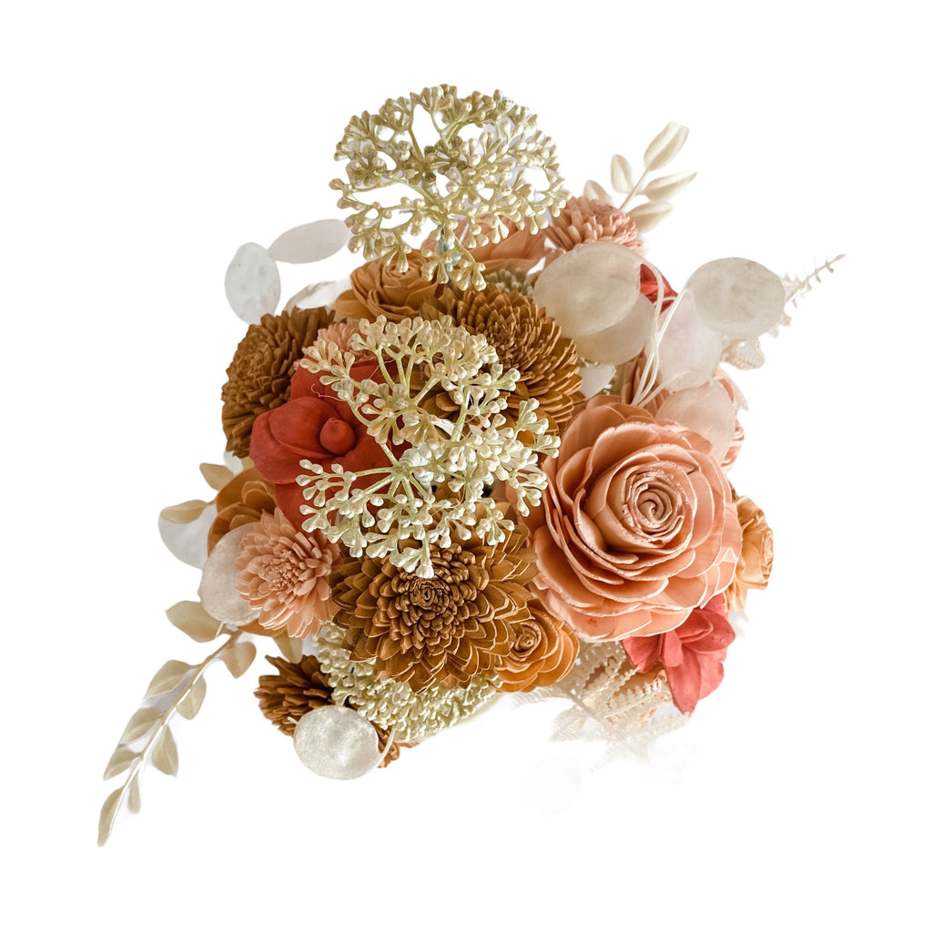 sola wood flower arrangement with peach and pinks for boho decor