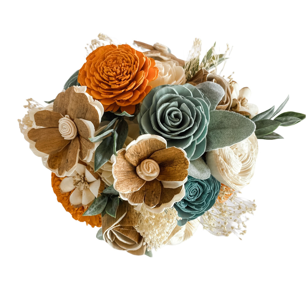 blue and orange and white sola wood flower centerpiece from pine and petal market