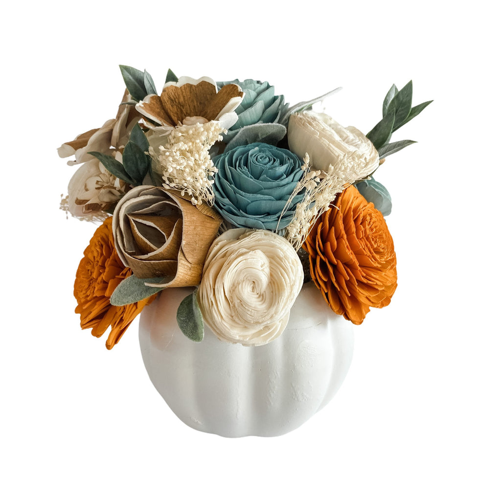 white pumpkin sola wood flower arrangement with teals, blues and orange