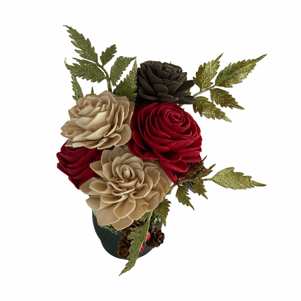 winter sola wood flower arrangement with red and brown pinecones