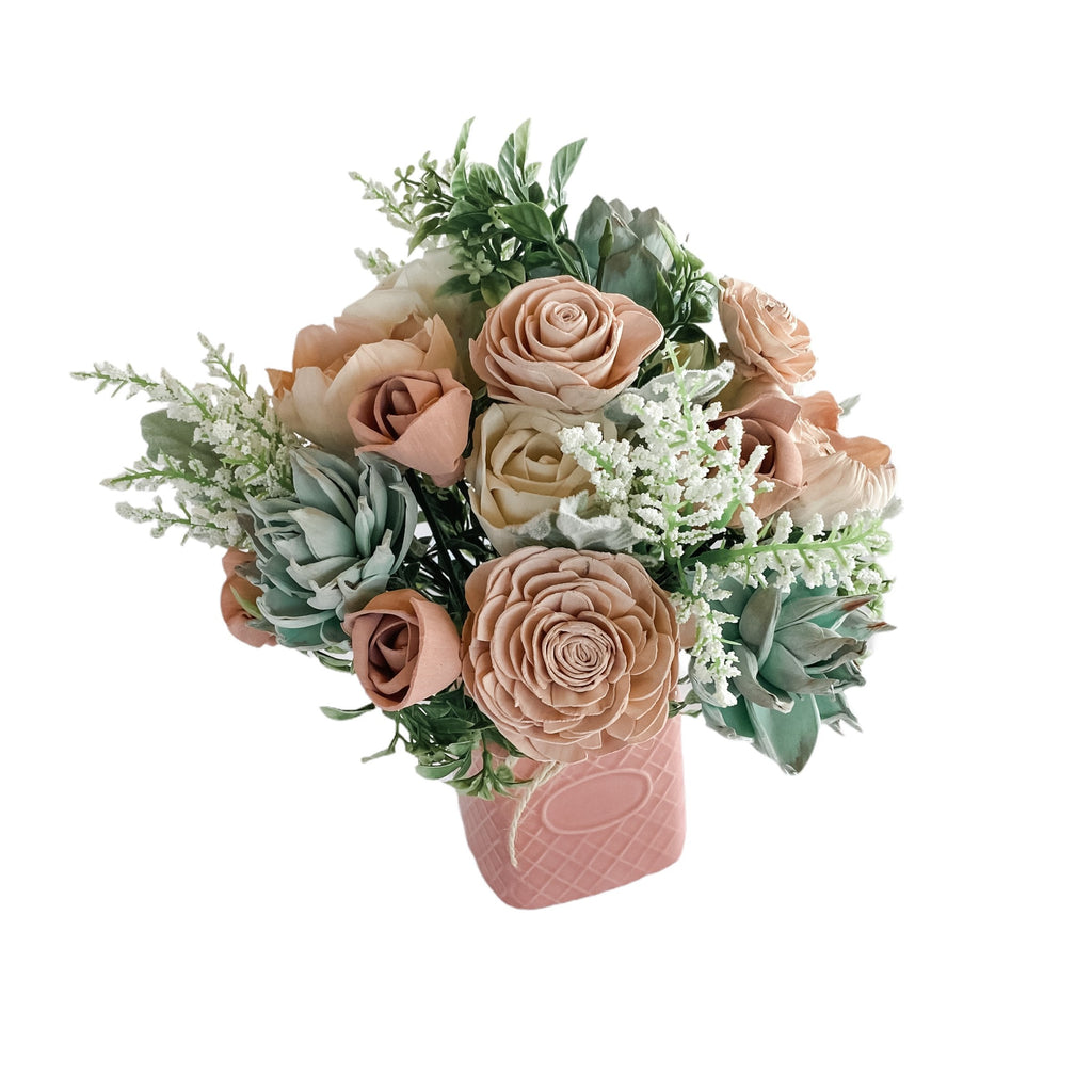 pine and petal sola flower arrangement with succulents and pink roses