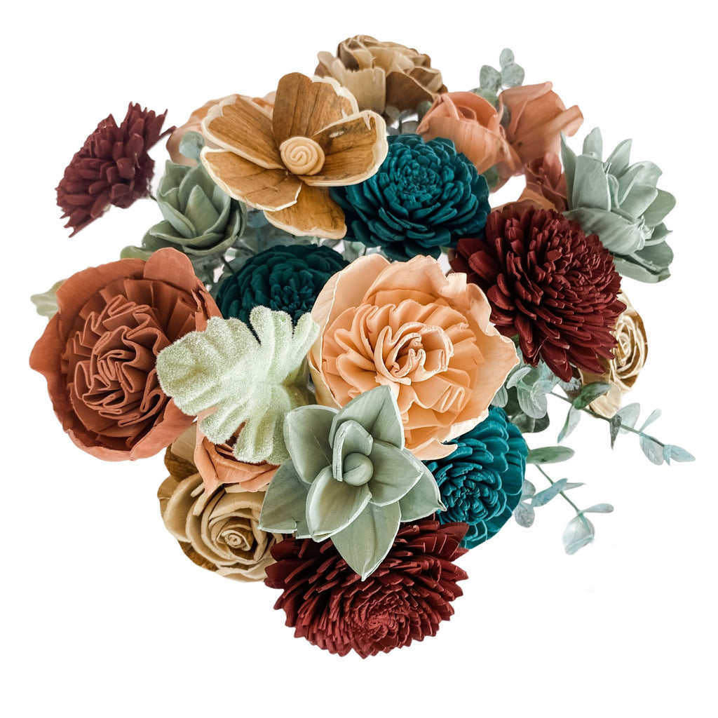 delicate sola wood flower arrangement in teal and wine from pine and petal