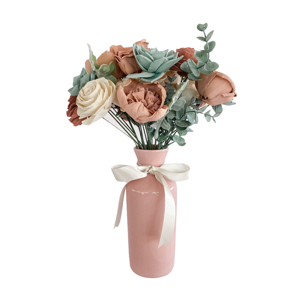 delicate pink, white and seafoam sola wood flower bouquet arrangement in dusty rose vase