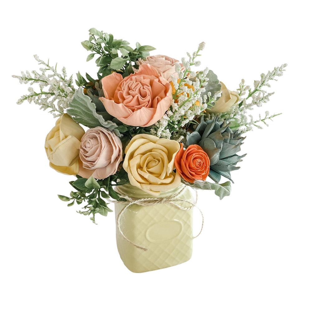 succulent sola wood flower arrangement in peach and yellow from Pine and Petal Market