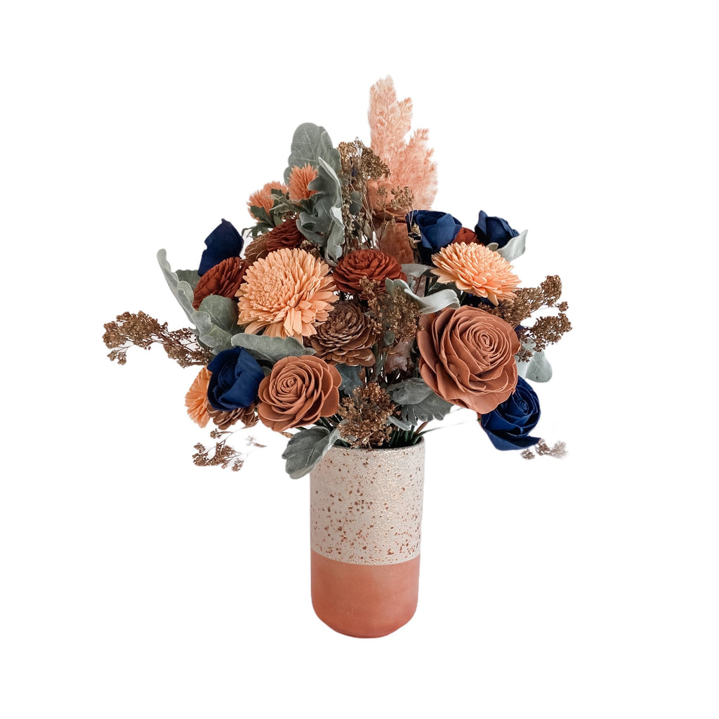 boho sola wood flower arrangement with navy, rose golds, pink, and sienna from pine and petal market