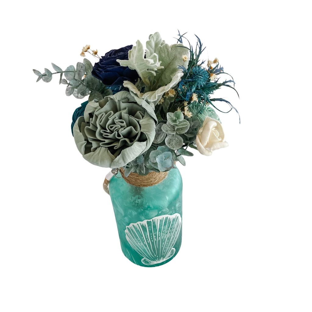 blue and sea greens sola wood flower arrangement for beach lovers birthday